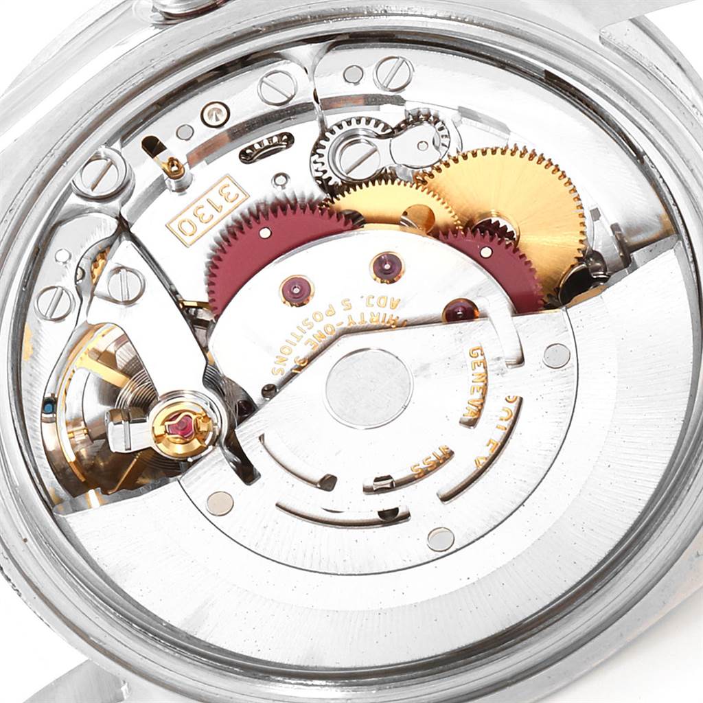 The image shows the inner mechanical movement of a Rolex Explorer 114270 Men's Stainless Steel Black Dial 114270 Men's Stainless Steel Black Dial watch, highlighting its gears and components.