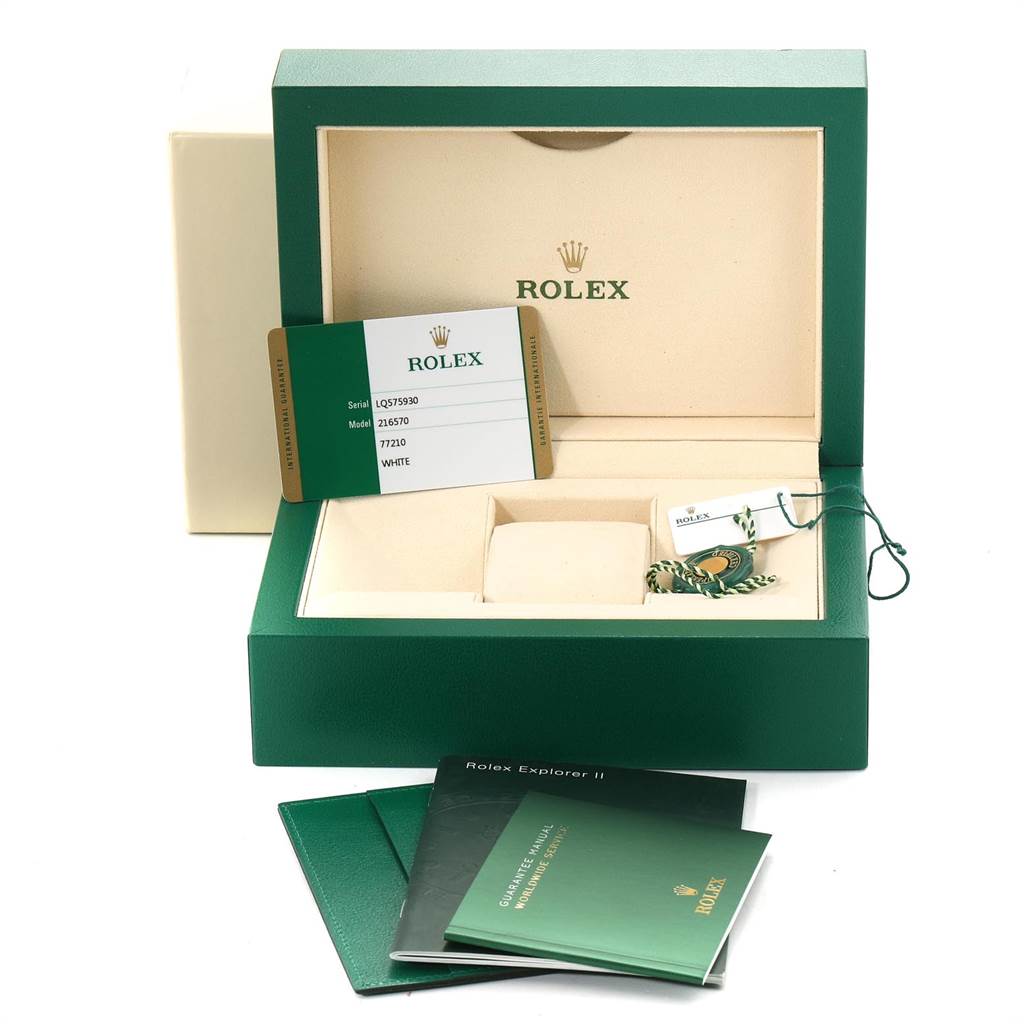 The image shows the open box for a Rolex Explorer 216570 Men's Stainless Steel White Dial 216570 Men's Stainless Steel White Dial watch, warranty card, tags, and manuals from a front angle.
