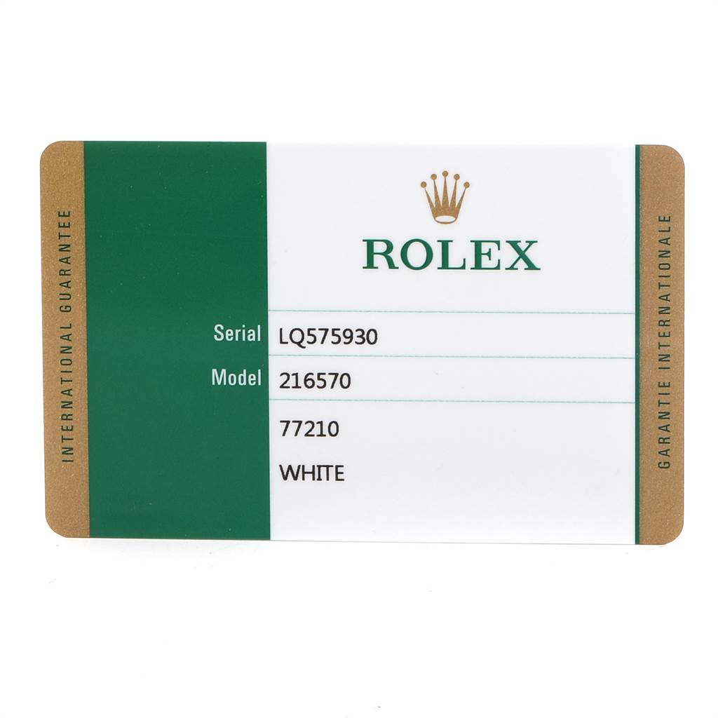 The image shows an International Guarantee card for a Rolex Explorer 216570 Men's Stainless Steel White Dial 216570 Men's Stainless Steel White Dial model 216570 with a serial number LQ575930.