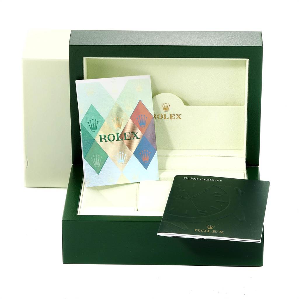 The image shows the watch box and manuals for a Rolex Explorer 16570 Men's Stainless Steel White Dial 16570 Men's Stainless Steel White Dial model, including the outer cardboard box and booklets.