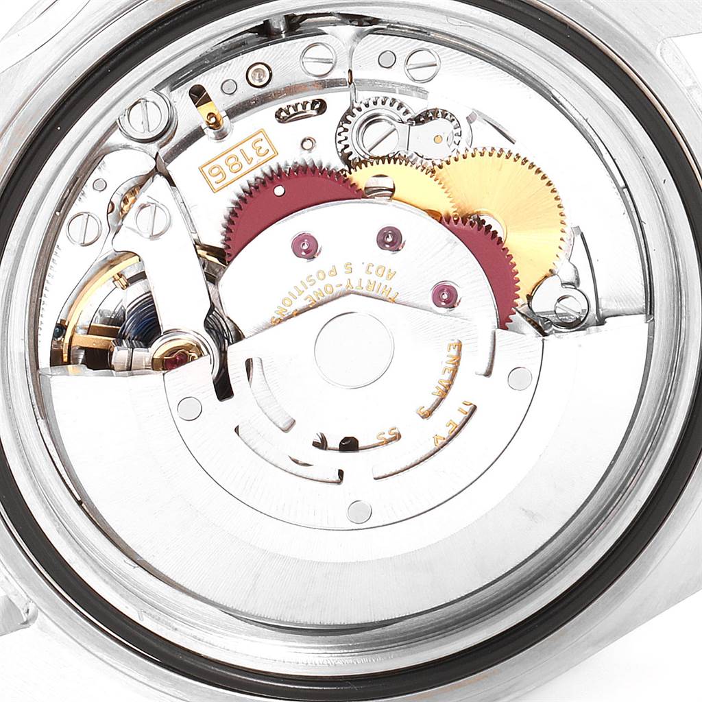 The image shows an internal view of the Rolex Explorer 16570 Men's Stainless Steel White Dial 16570 Men's Stainless Steel White Dial watch, highlighting its intricate mechanical movement and gears.