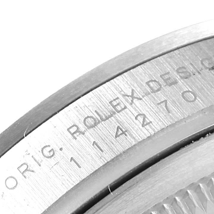 This image shows a partial close-up of the inner case back and model number of a Rolex Explorer 114270 Men's Stainless Steel Black Dial 114270 Men's Stainless Steel Black Dial watch.