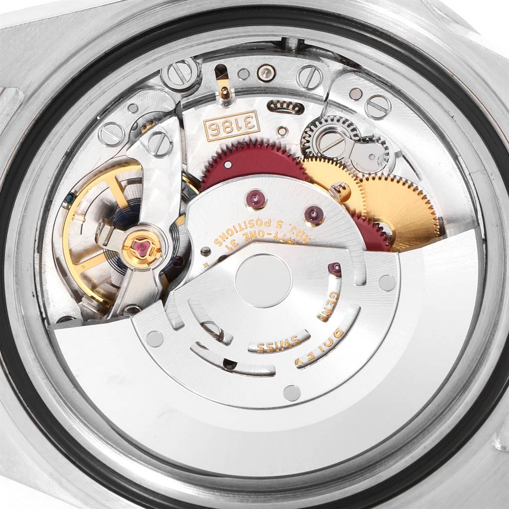 This is a close-up shot of the movement inside a Rolex Explorer 16570 Men's Stainless Steel White Dial 16570 Men's Stainless Steel White Dial watch, highlighting the intricate mechanics and gears.