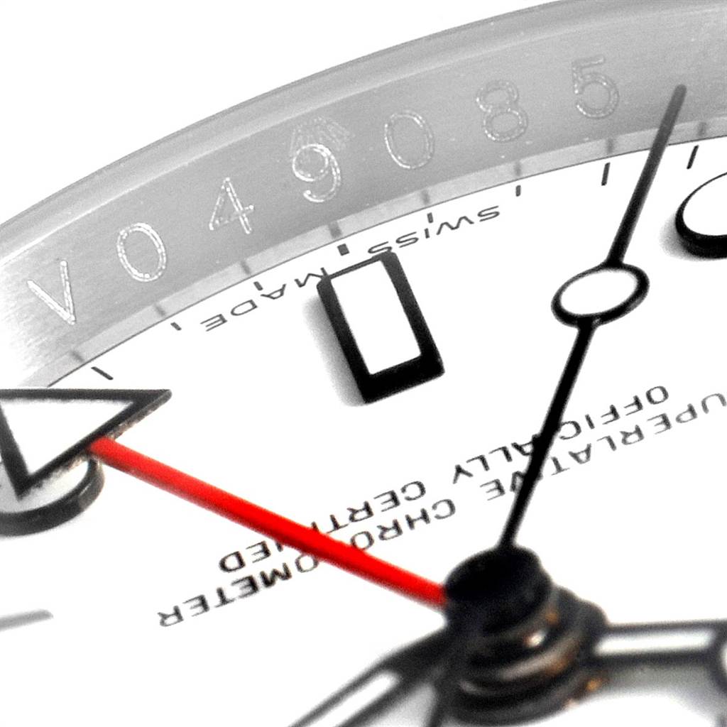 This close-up of the Rolex Explorer 16570 Men's Stainless Steel White Dial 16570 Men's Stainless Steel White Dial watch shows part of the dial, hands, and engraved serial number on the inner bezel.