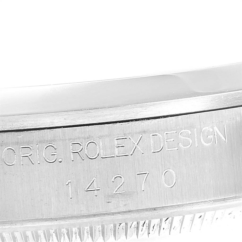 The image shows a close-up of the side casing of a Rolex Explorer 14270 Men's Stainless Steel Black Dial 14270 Men's Stainless Steel Black Dial watch with the engraved model number 14270.