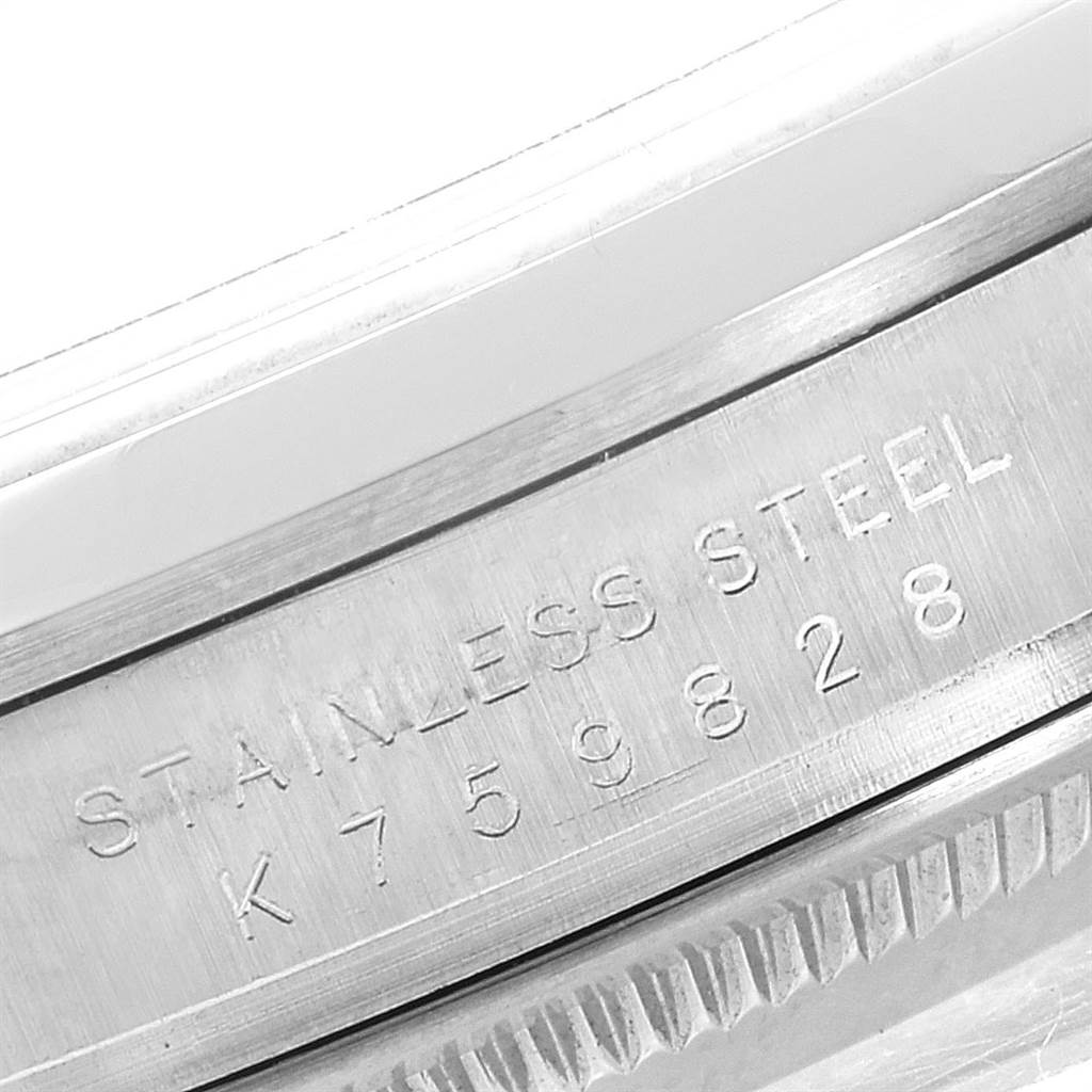 The image shows a close-up of the serial number and "Stainless Steel" engraving on the side of a Rolex Explorer 114270 Men's Stainless Steel Black Dial 114270 Men's Stainless Steel Black Dial watch case.
