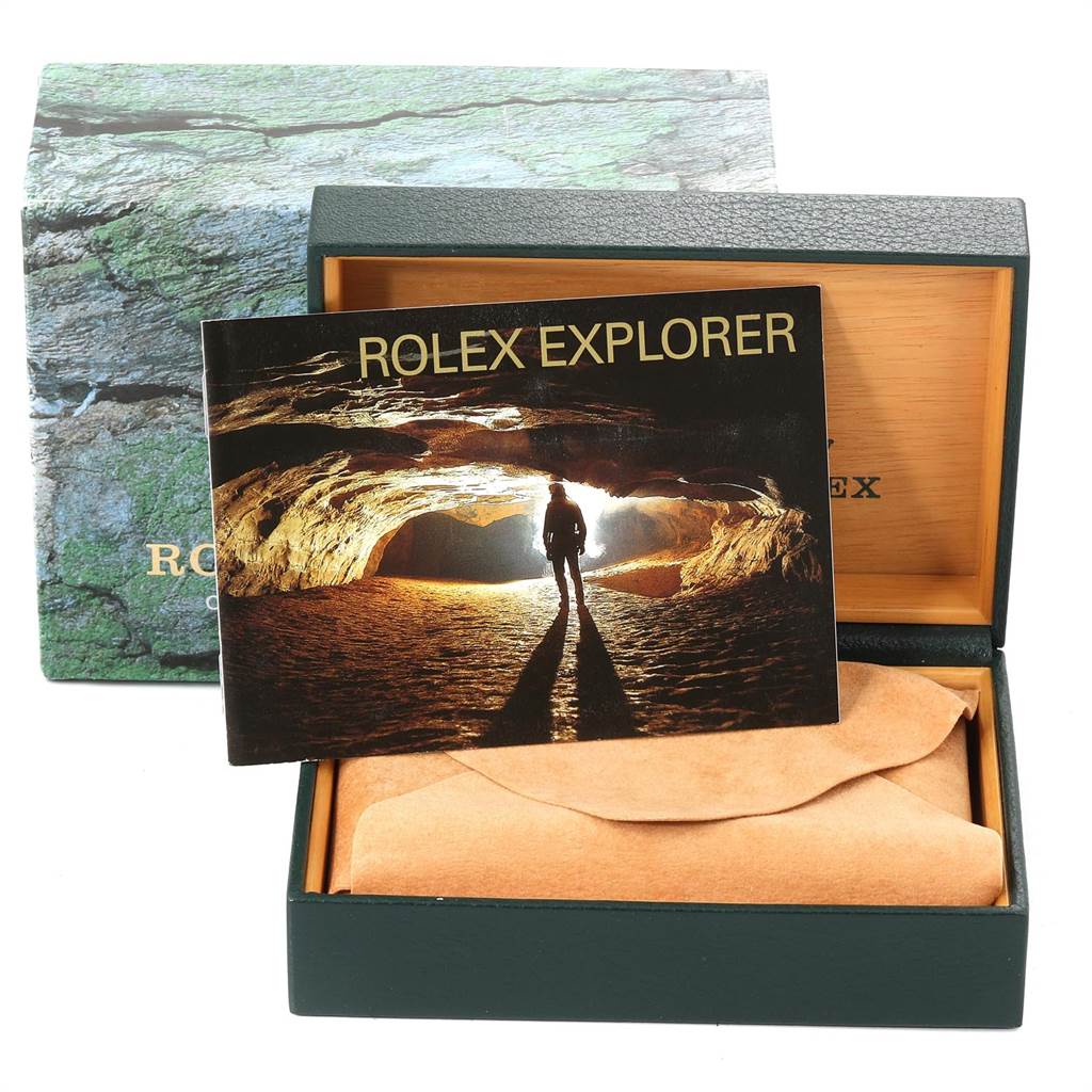 The image shows the box and manual for the Rolex Explorer 114270 Men's Stainless Steel Black Dial 114270 Men's Stainless Steel Black Dial model.