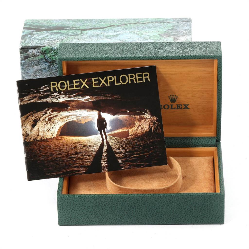 The image shows an open Rolex Explorer 14270 Men's Stainless Steel Black Dial 14270 Men's Stainless Steel Black Dial box with a booklet on top.