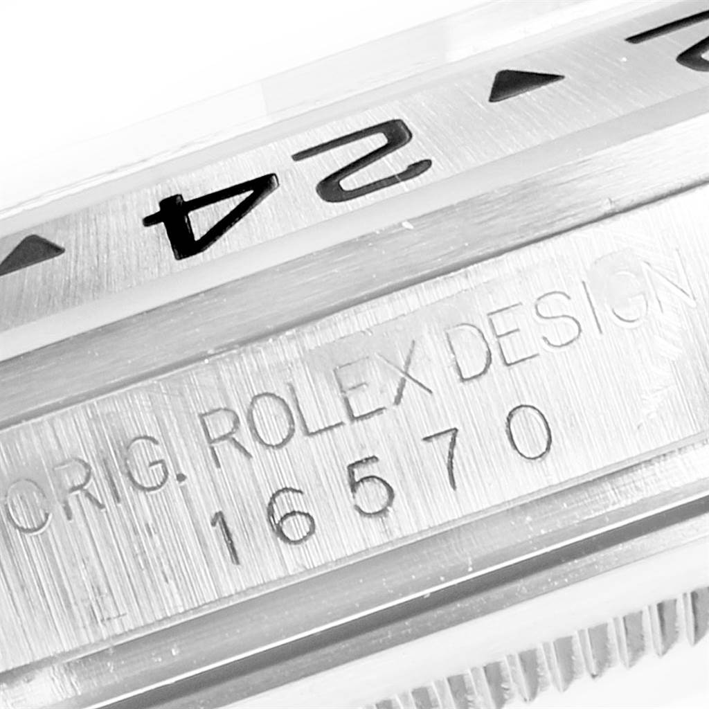 Close-up of the case side and partially visible bezel of a Rolex Explorer 16570 Men's Stainless Steel White Dial 16570 Men's Stainless Steel White Dial model emphasizing the engraved Rolex Design number 16570.