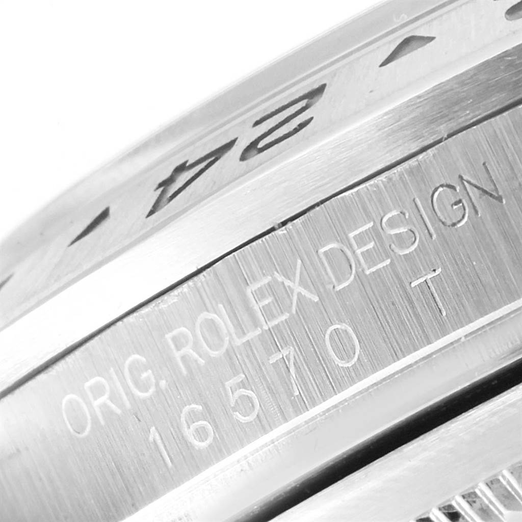 This close-up image shows the bezel and engraved case side of a Rolex Explorer 16570 Men's Stainless Steel Black Dial 16570 Men's Stainless Steel Black Dial watch.