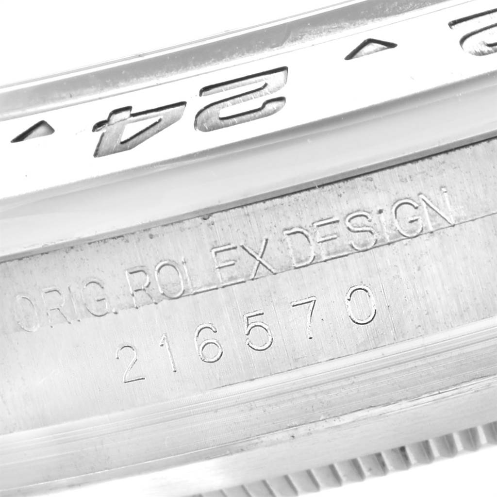 The close-up image shows the engraved bezel and serial number of a Rolex Explorer 216570 Men's Stainless Steel Black Dial 216570 Men's Stainless Steel Black Dial watch.