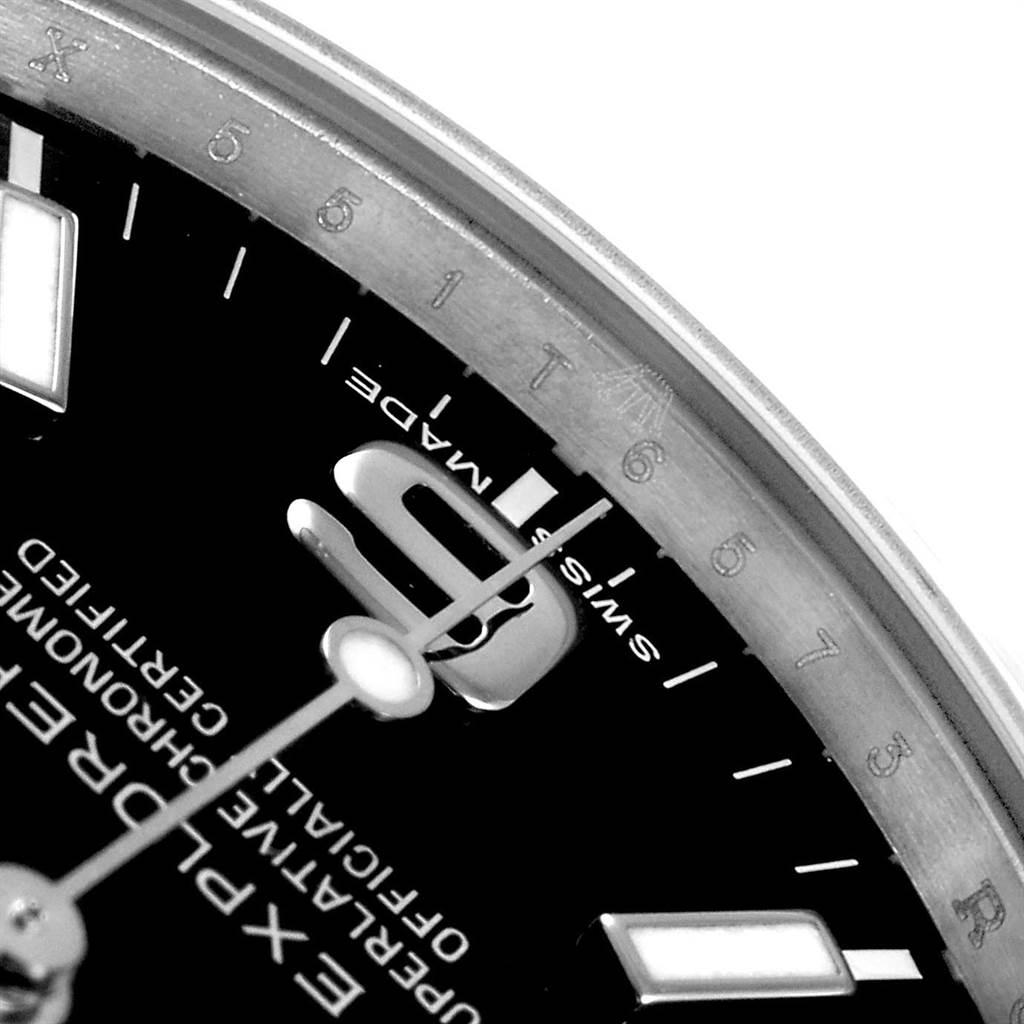 The image shows a close-up of the dial on a Rolex Explorer 214270 Men's Stainless Steel Black Dial 214270 Men's Stainless Steel Black Dial, highlighting the "Swiss Made" text and part of the hour markers.