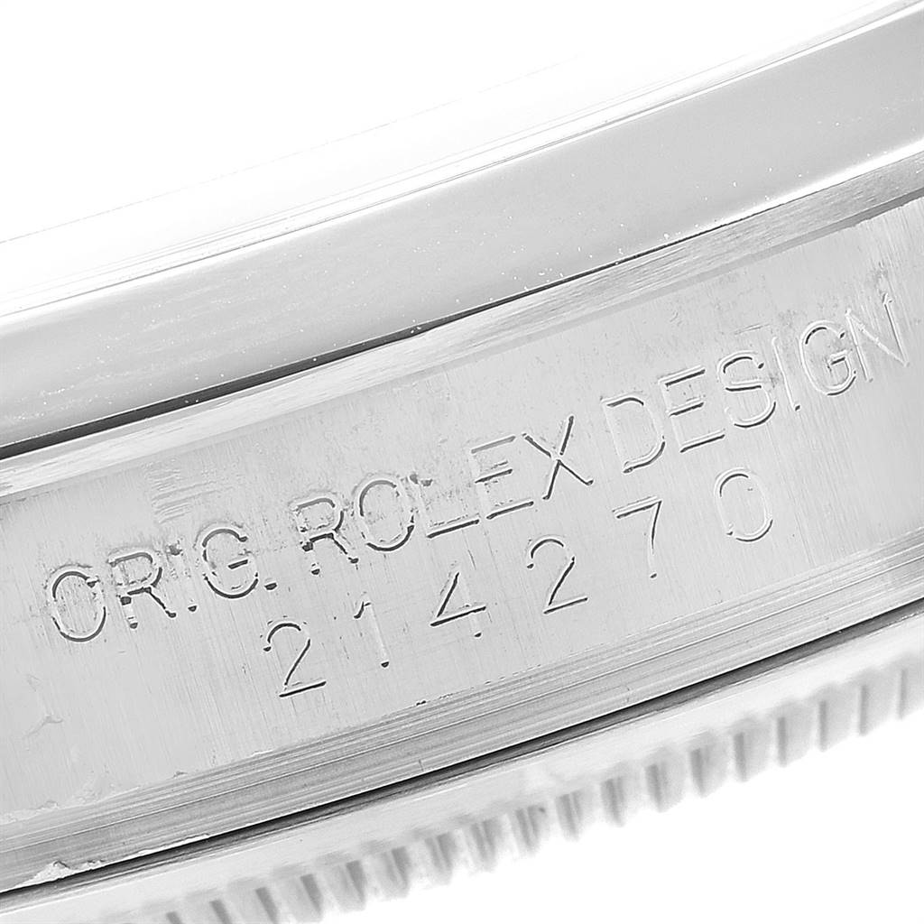 This image shows a close-up of the engraved side of the case of a Rolex Explorer 214270 Men's Stainless Steel Black Dial 214270 Men's Stainless Steel Black Dial watch.