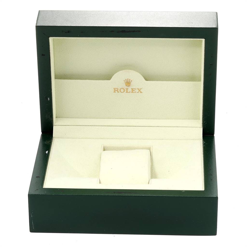 This image shows an empty Rolex watch box, specifically for the Explorer model, with a cushioned interior and green exterior.