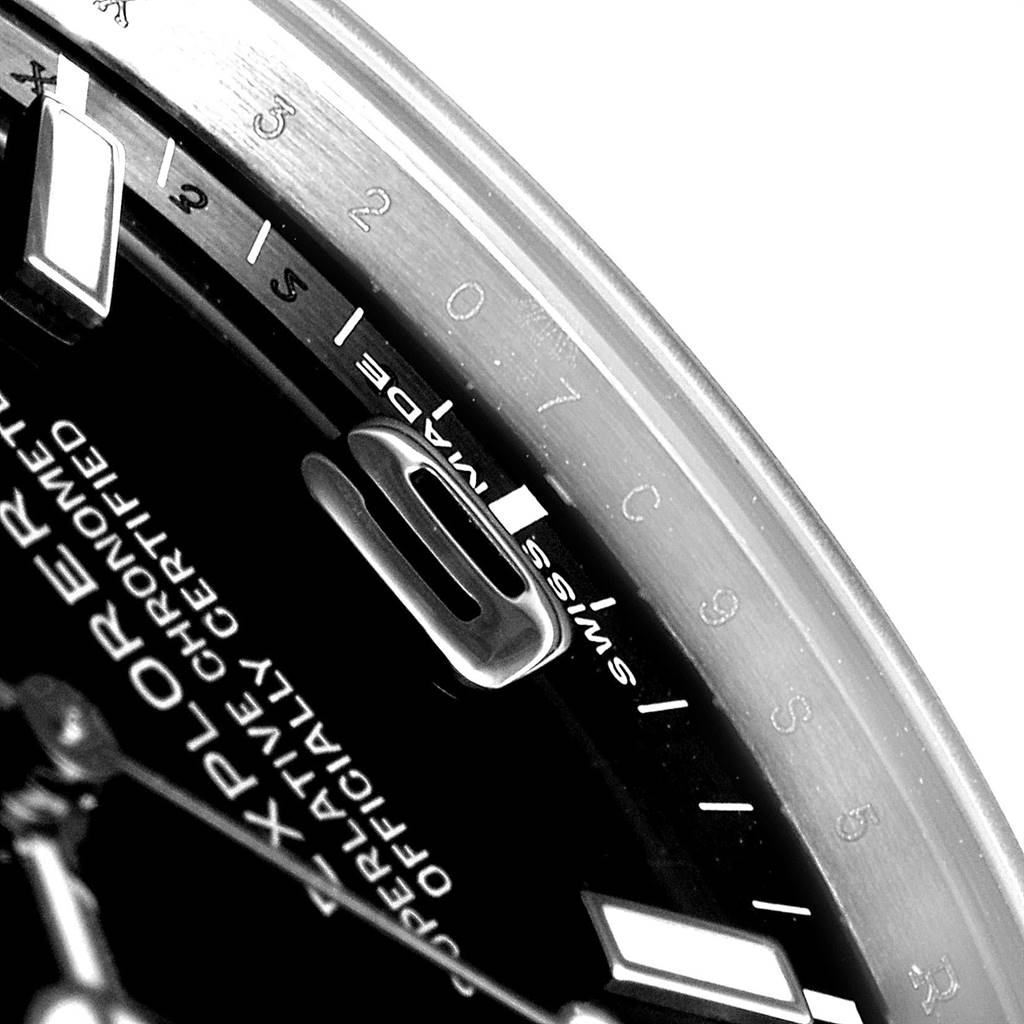 The image shows a close-up angle of the dial and bezel of a Rolex Explorer 214270 Men's Stainless Steel Black Dial 214270 Men's Stainless Steel Black Dial watch, with visible hour markers and part of the numerals.
