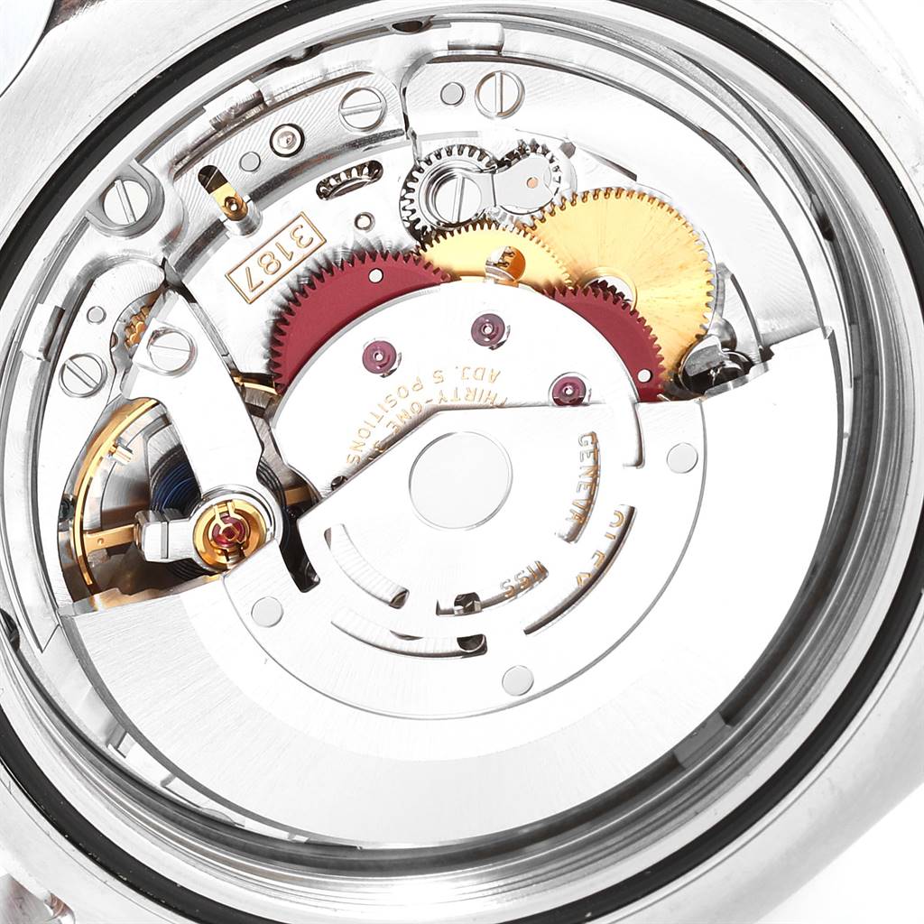 The image shows the internal mechanism of a Rolex Explorer 216570 Men's Stainless Steel Black Dial 216570 Men's Stainless Steel Black Dial watch with various gears and components visible.