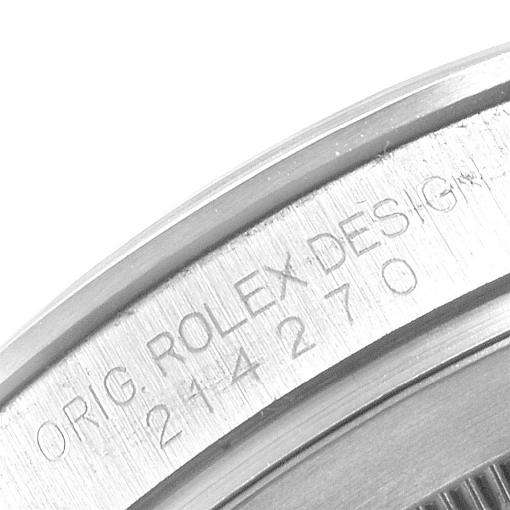 This image shows a close-up view of the engraved serial number on the side of a Rolex Explorer 214270 Men's Stainless Steel Black Dial 214270 Men's Stainless Steel Black Dial watch case.