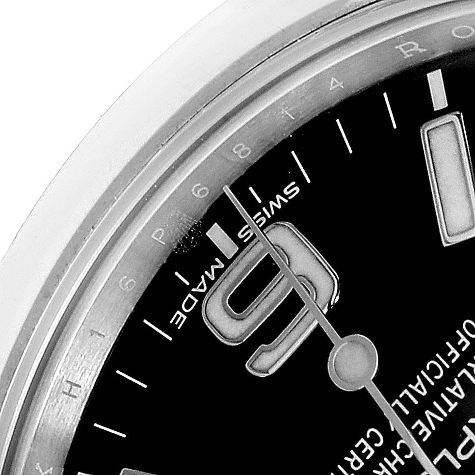 The image shows a close-up of the outer edge, the hour hand, and part of the dial, including the "9" numeral, on a Rolex Explorer 214270 Men's Stainless Steel Black Dial 214270 Men's Stainless Steel Black Dial watch.