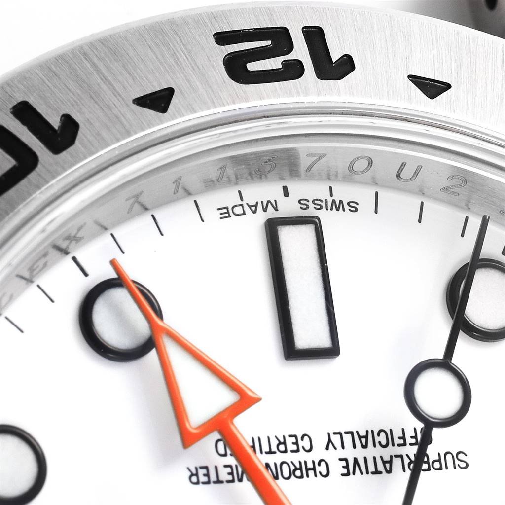 This close-up angle shows the bezel, part of the dial, and hands of the Rolex Explorer 216570 Men's Stainless Steel White Dial 216570 Men's Stainless Steel White Dial watch.