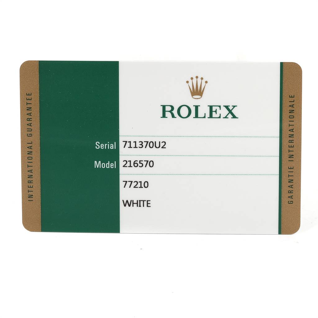 This image shows the international guarantee card for a Rolex Explorer 216570 Men's Stainless Steel White Dial 216570 Men's Stainless Steel White Dial model 216570.