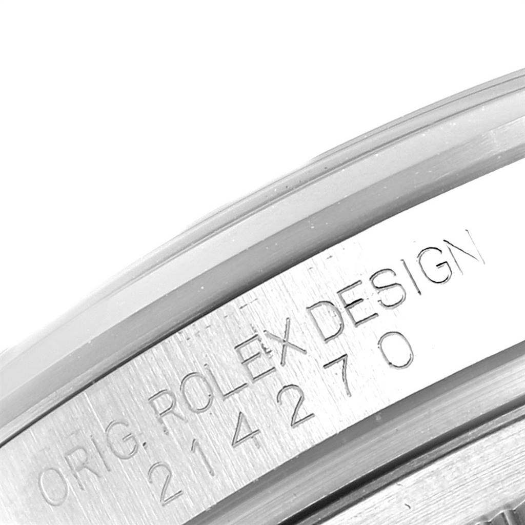 The image shows a close-up of the engraving on the side of the case of a Rolex Explorer 214270 Men's Stainless Steel Black Dial 214270 Men's Stainless Steel Black Dial model watch.