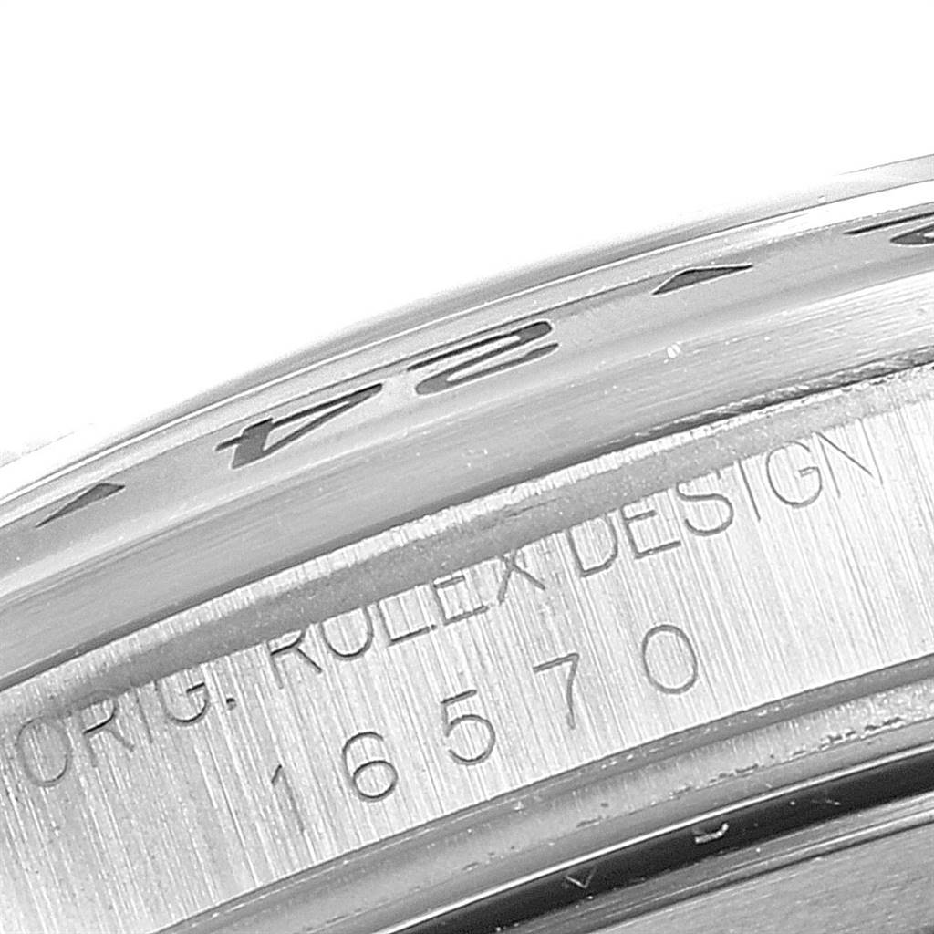 This image shows a close-up of the model number and branding engraved on the side of a Rolex Explorer 16570 Men's Stainless Steel White Dial 16570 Men's Stainless Steel White Dial watch.
