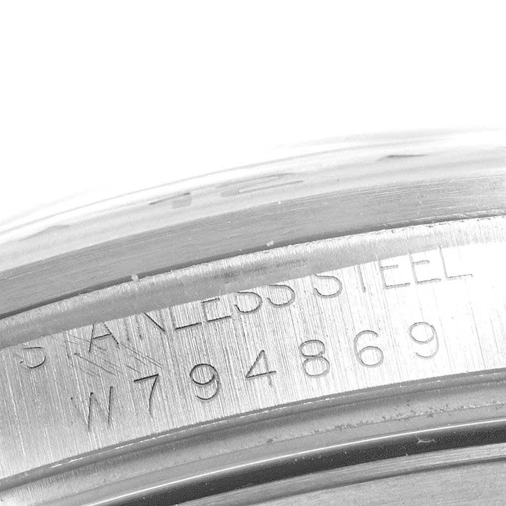 This close-up shot shows the stainless steel casing with engraved serial numbers of the Rolex Explorer 16570 Men's Stainless Steel White Dial 16570 Men's Stainless Steel White Dial watch.