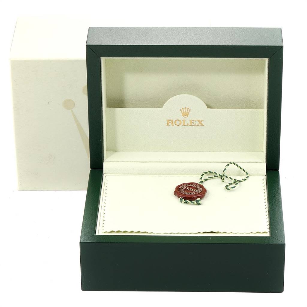 The image shows an open Rolex Explorer 16570 Men's Stainless Steel White Dial 16570 Men's Stainless Steel White Dial watch box, displaying only the empty interior and accessories like tags and a cleaning cloth.