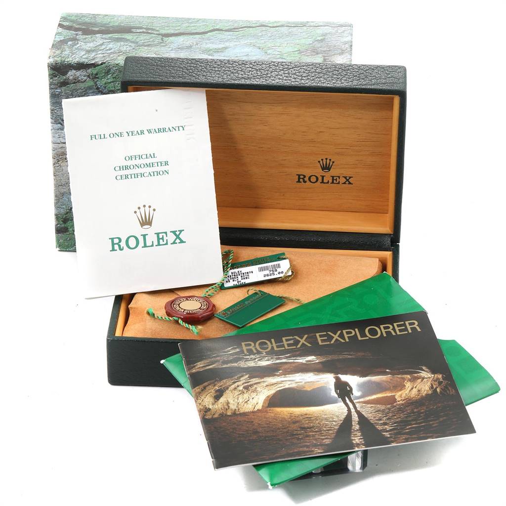 The image shows a Rolex Explorer 14270 Men's Stainless Steel Black Dial 14270 Men's Stainless Steel Black Dial watch box and accessories, including manuals, warranty card, tags, and chronometer certification.