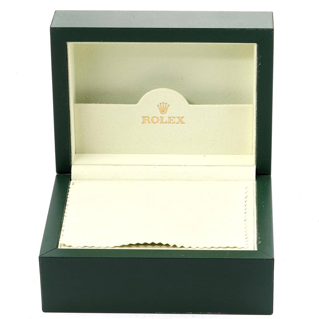 The image shows an open green Rolex box, which is a case for the Explorer model watch.