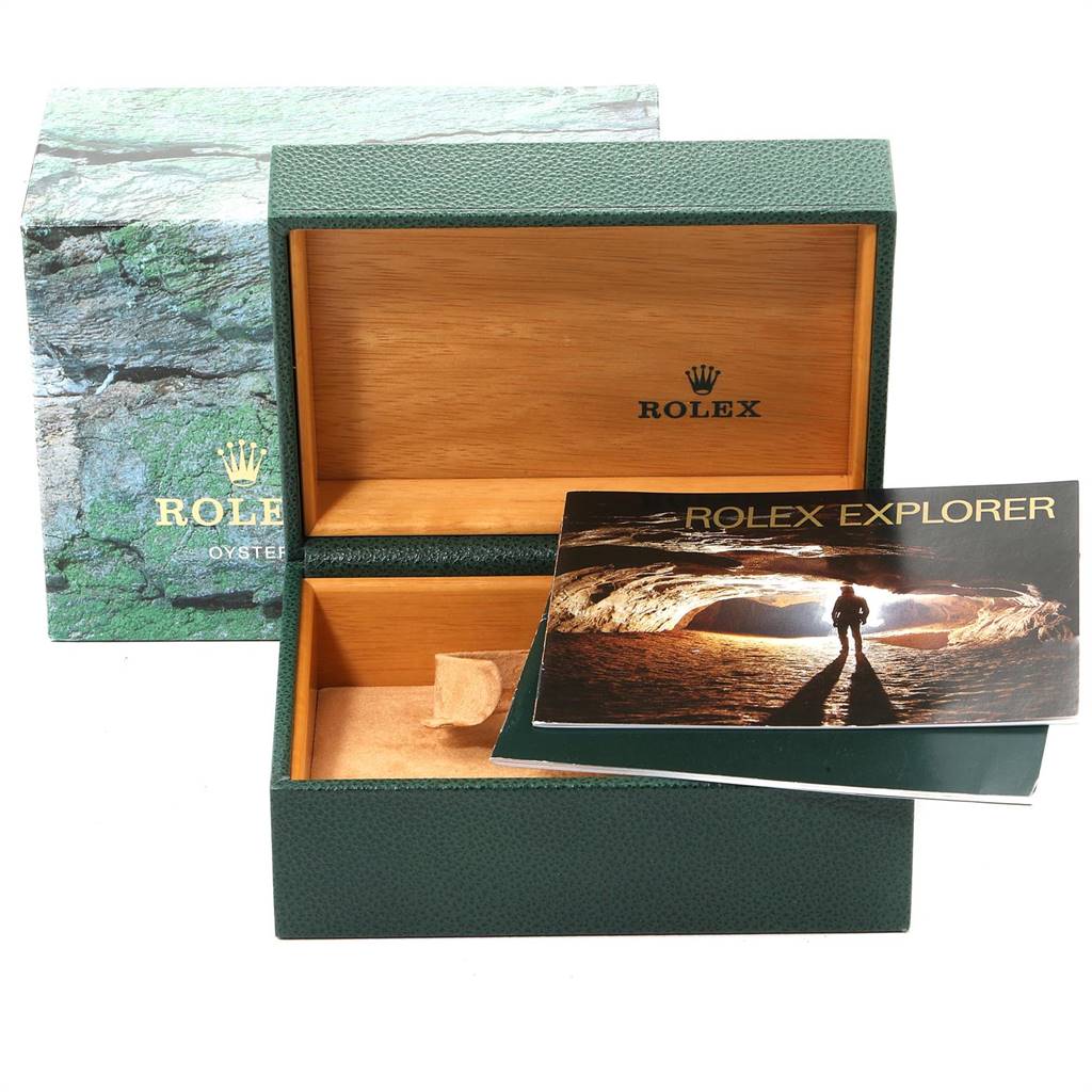 Rolex Explorer 16570 Men's Stainless Steel White Dial 16570 Men's Stainless Steel White Dial packaging includes an open green watch box with a wooden interior and a manual.