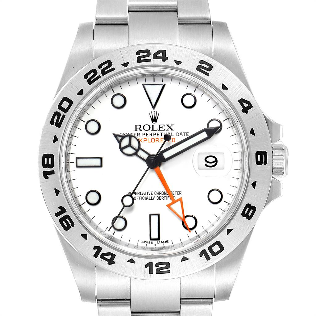 This image shows the face and bezel of a Rolex Explorer 216570 Men's Stainless Steel White Dial 216570 Men's Stainless Steel White Dial with a white dial and an orange 24-hour hand.
