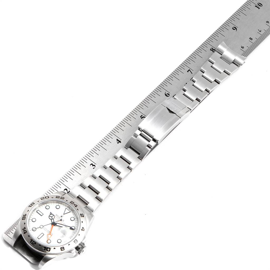 The image shows a top-down view of a Rolex Explorer 216570 Men's Stainless Steel White Dial 216570 Men's Stainless Steel White Dial watch with its bracelet measured by a ruler.
