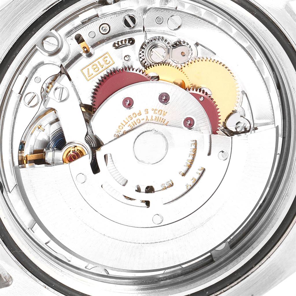 This image shows the internal mechanical movement of a Rolex Explorer 216570 Men's Stainless Steel White Dial 216570 Men's Stainless Steel White Dial watch, focusing on its gears and rotor.