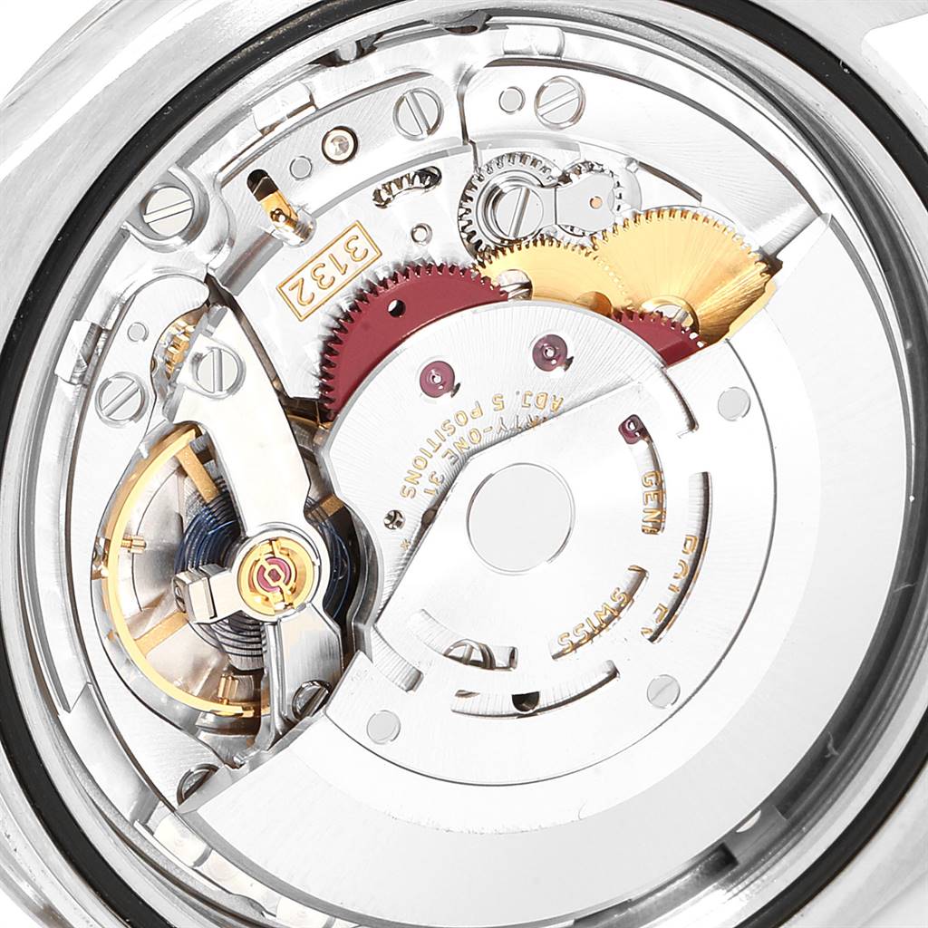 This is a close-up view of the internal mechanism of a Rolex Explorer 214270 Men's Stainless Steel Black Dial 214270 Men's Stainless Steel Black Dial watch, showing gears and other components.