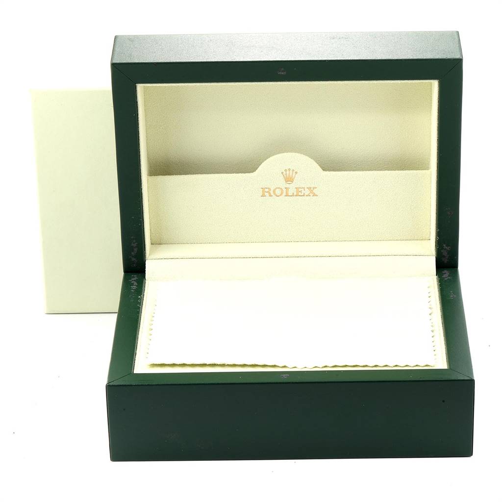 The image shows an empty green leather Rolex watch box for the Explorer model, opened to reveal the interior.