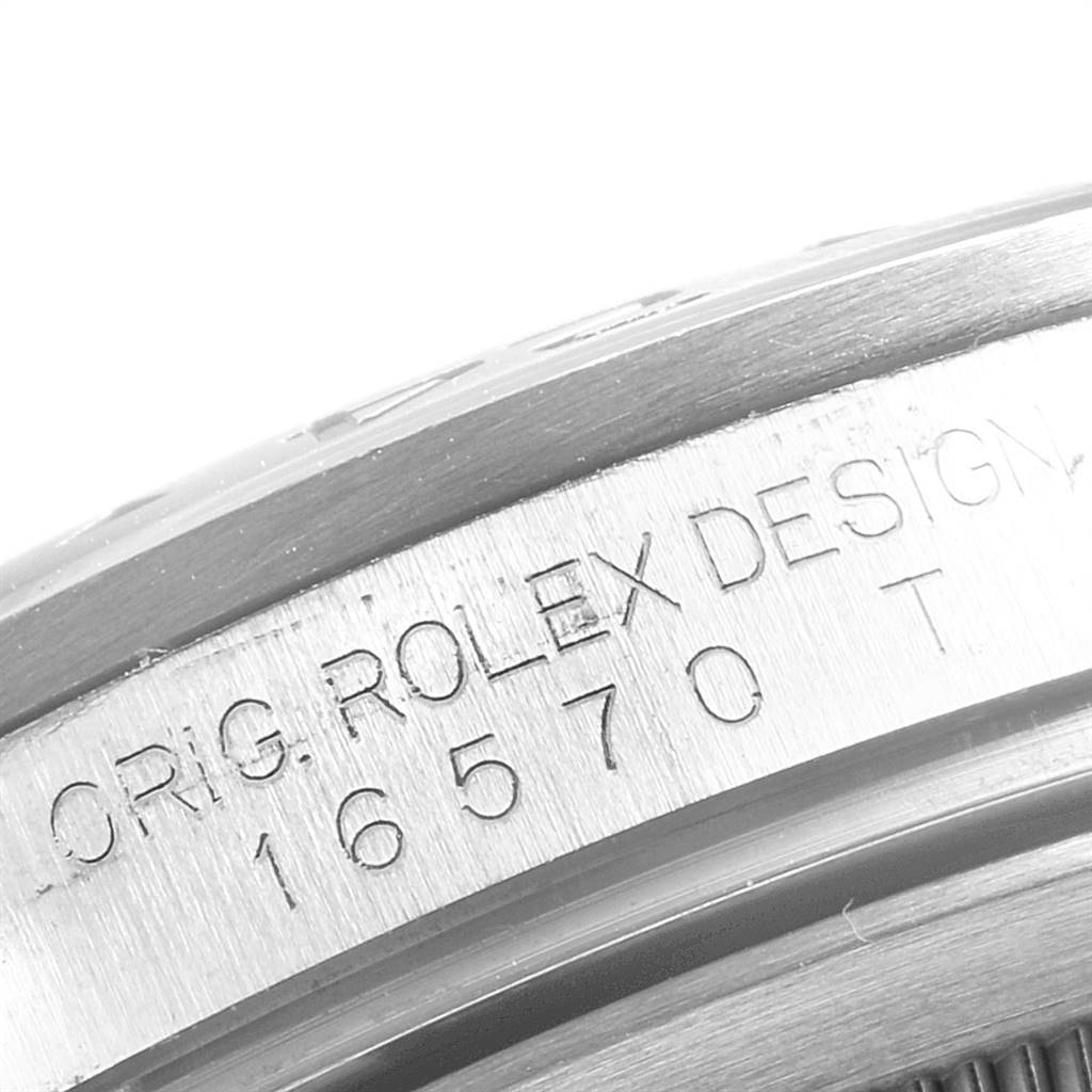 The image shows a close-up of the case with the engraving "ORIG. ROLEX DESIGN 16570" on the Rolex Explorer 16570 Men's Stainless Steel Black Dial 16570 Men's Stainless Steel Black Dial watch.