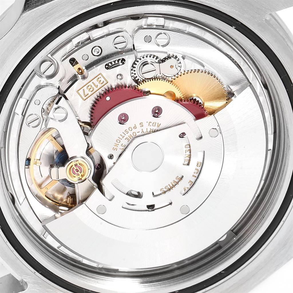 The image shows the intricate internal mechanism of the Rolex Explorer 216570 Men's Stainless Steel Black Dial 216570 Men's Stainless Steel Black Dial watch, viewed from the back, highlighting its gears and components.