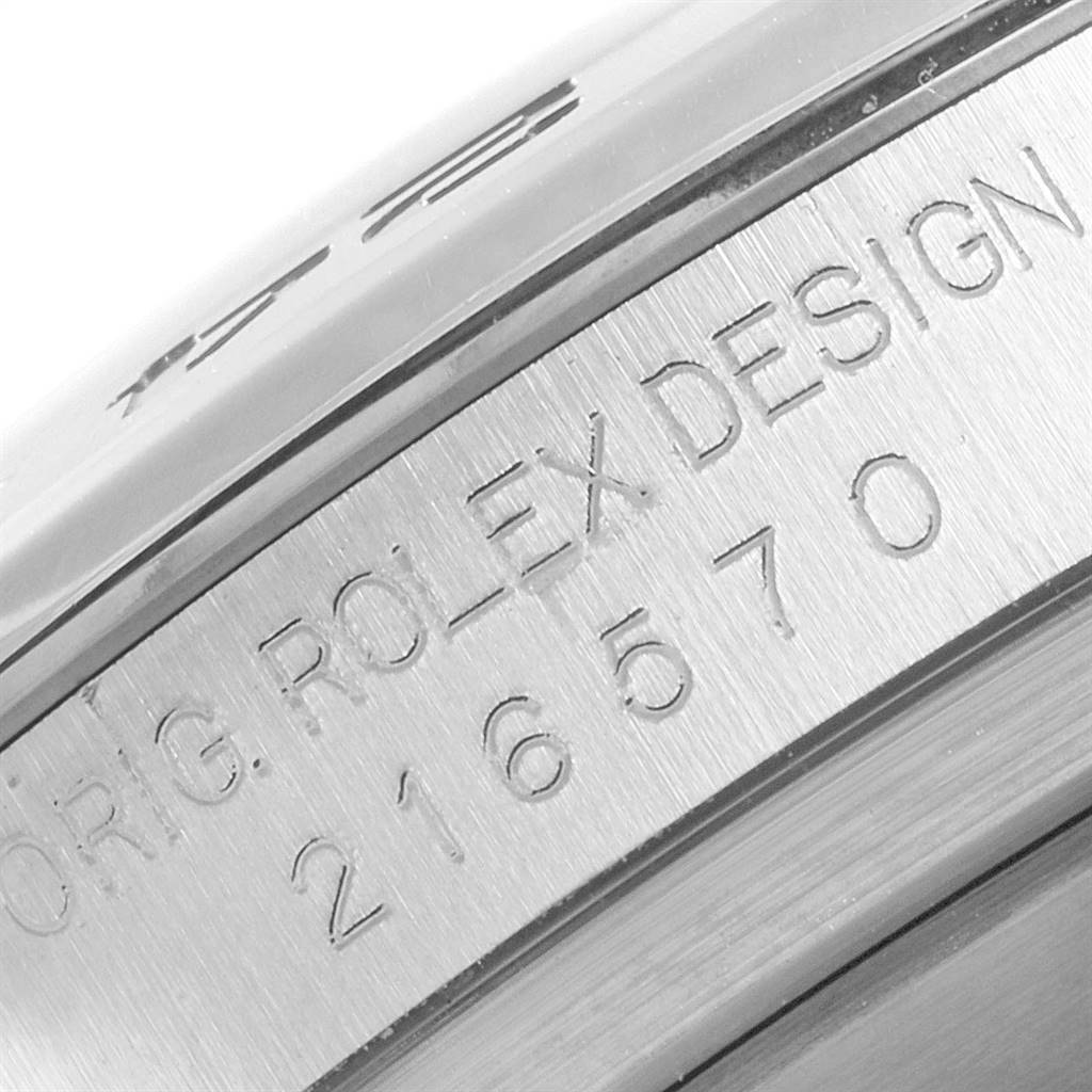 Close-up of the Rolex Explorer 216570 Men's Stainless Steel Black Dial 216570 Men's Stainless Steel Black Dial watch case showing the model number "216570" and "ORIG. ROLEX DESIGN."