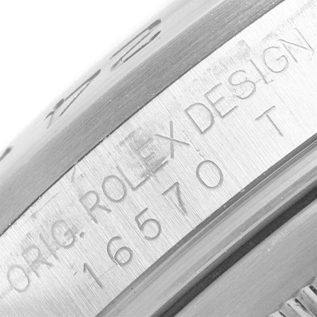This close-up image shows the engraved serial number and design details on the side of a Rolex Explorer 16570 Men's Stainless Steel White Dial 16570 Men's Stainless Steel White Dial watch model.