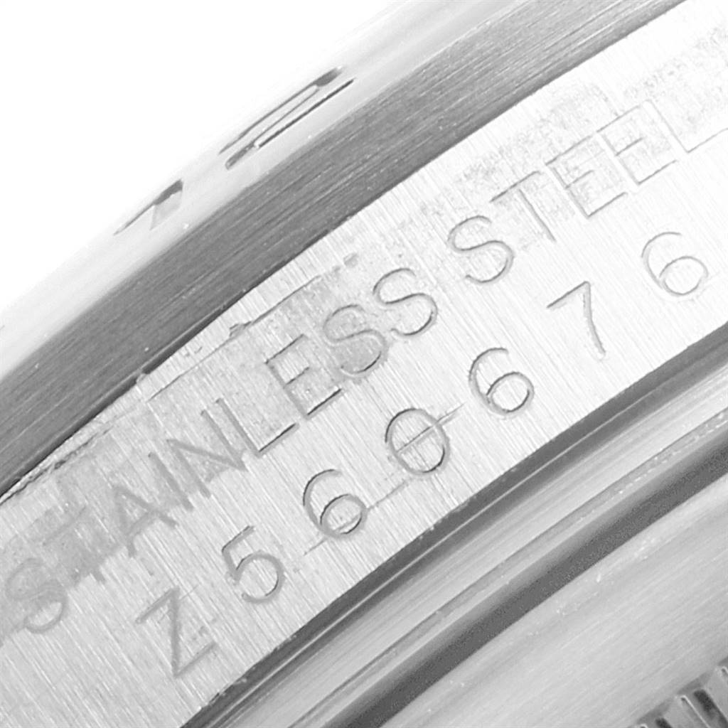 This close-up image shows the engraving on the case back of a Rolex Explorer 16570 Men's Stainless Steel White Dial 16570 Men's Stainless Steel White Dial watch, featuring the "STAINLESS STEEL" text.