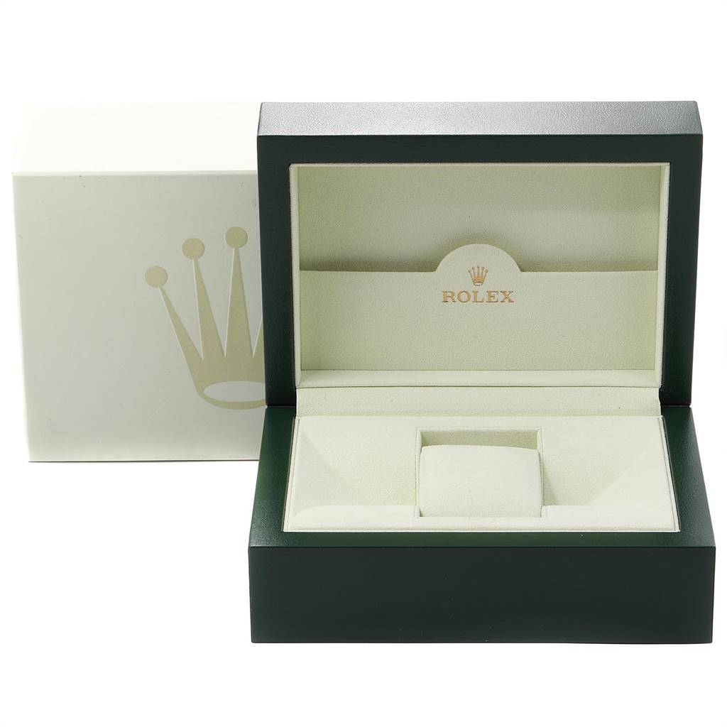 This image shows an open Rolex watch box for an Explorer model, with the exterior box in the background.