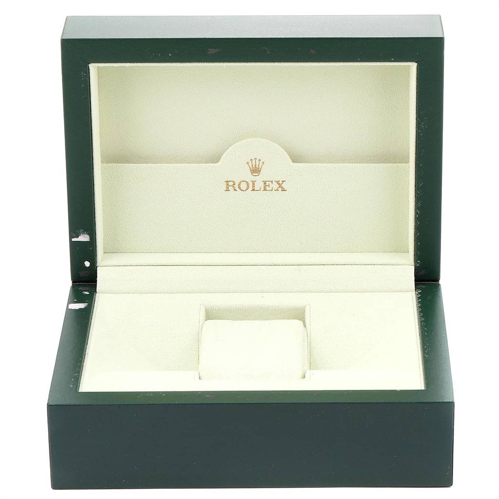 This image shows an open green and beige Rolex watch box for the Explorer model.