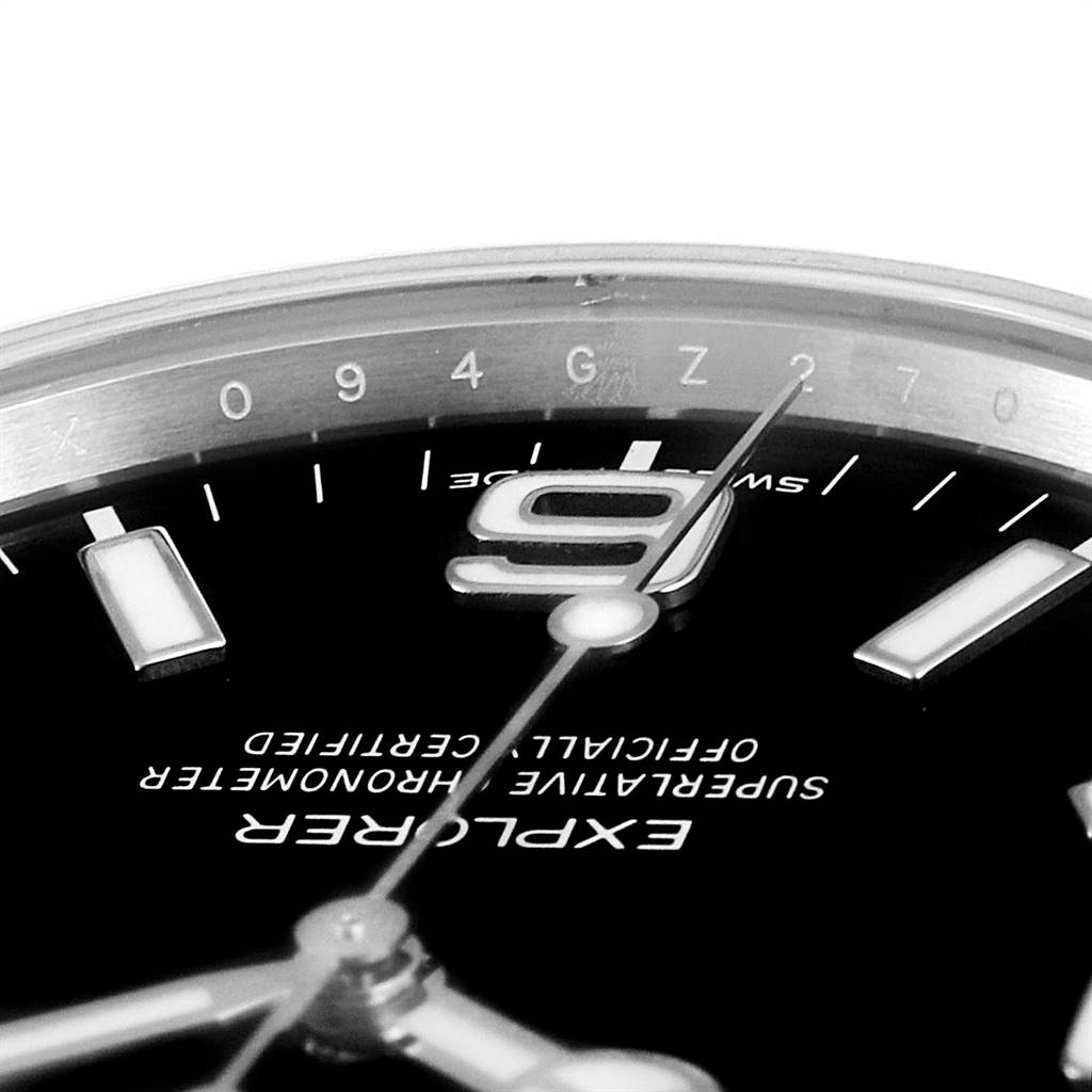 The image shows a close-up view of the dial and bezel of a Rolex Explorer 214270 Men's Stainless Steel Black Dial 214270 Men's Stainless Steel Black Dial watch, highlighting the "Explorer" text and 9-hour marker.