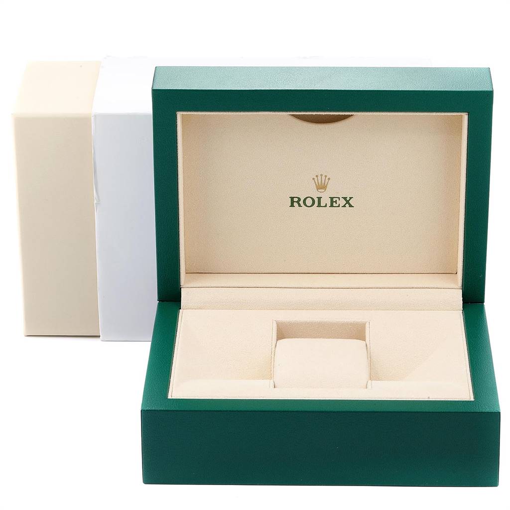 The image shows an open Rolex watch box for the Explorer model, with a green exterior and beige interior.