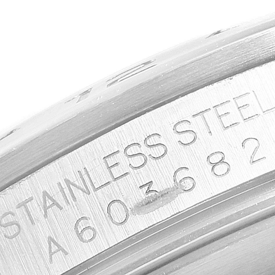 This image shows an extreme close-up of the stainless steel casing and serial number of a Rolex Explorer 16570 Men's Stainless Steel White Dial 16570 Men's Stainless Steel White Dial watch.