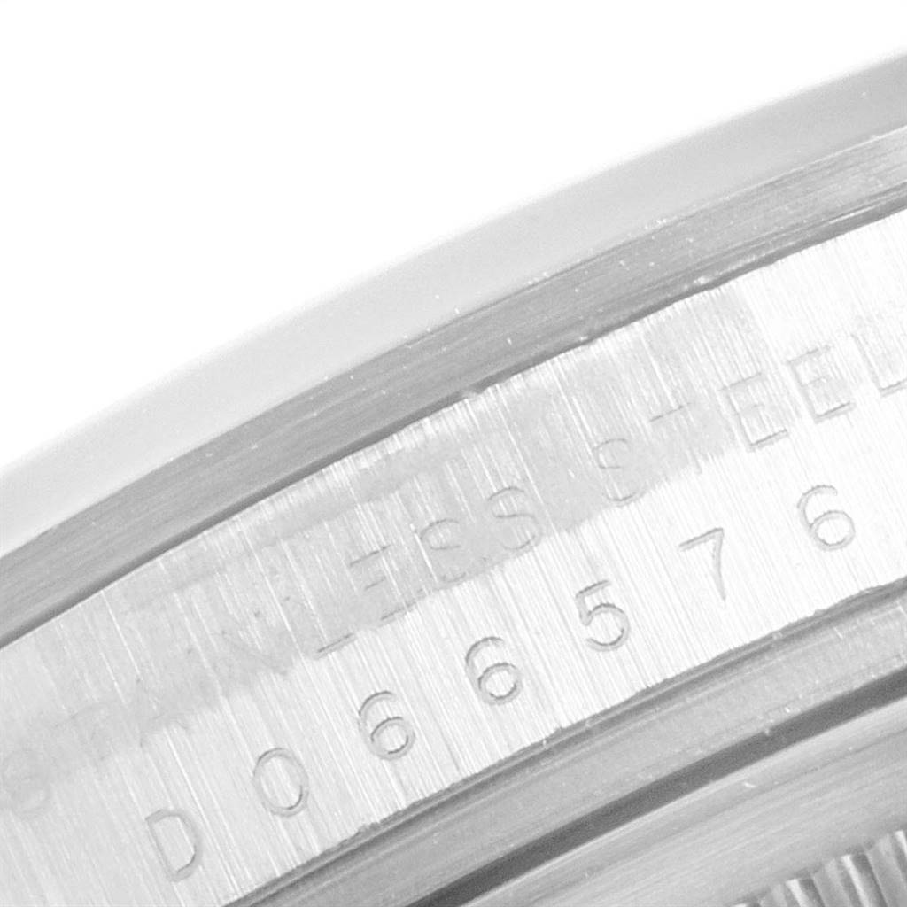This image shows a close-up view of the serial number and bezel edge of a Rolex Explorer 114270 Men's Stainless Steel Black Dial 114270 Men's Stainless Steel Black Dial watch.