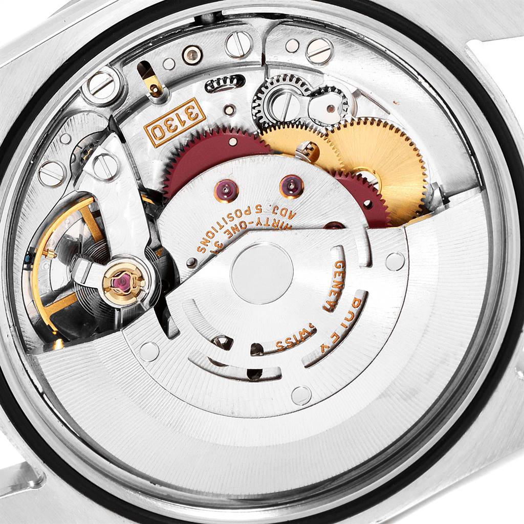 This image shows the internal movement mechanism of a Rolex Explorer 114270 Men's Stainless Steel Black Dial 114270 Men's Stainless Steel Black Dial watch, featuring gears and other intricate components.