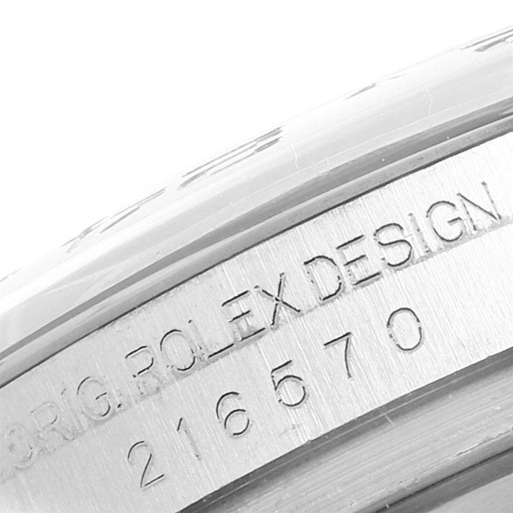 The image shows a close-up of the engraving on the case side of a Rolex Explorer 216570 Men's Stainless Steel Black Dial 216570 Men's Stainless Steel Black Dial watch.