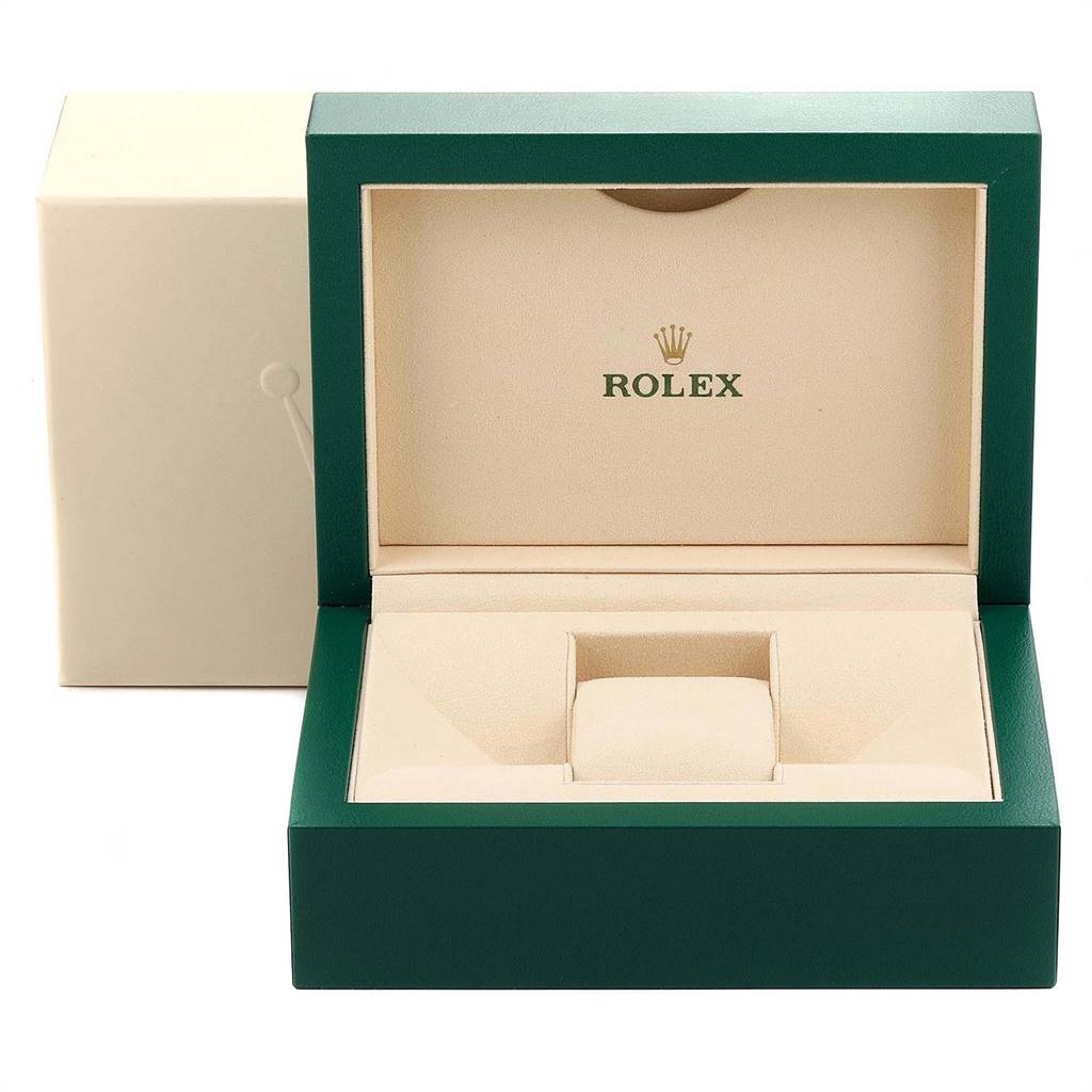 The image shows an open Rolex Explorer 216570 Men's Stainless Steel Black Dial 216570 Men's Stainless Steel Black Dial watch box, highlighting its interior with beige cushioning and green exterior.